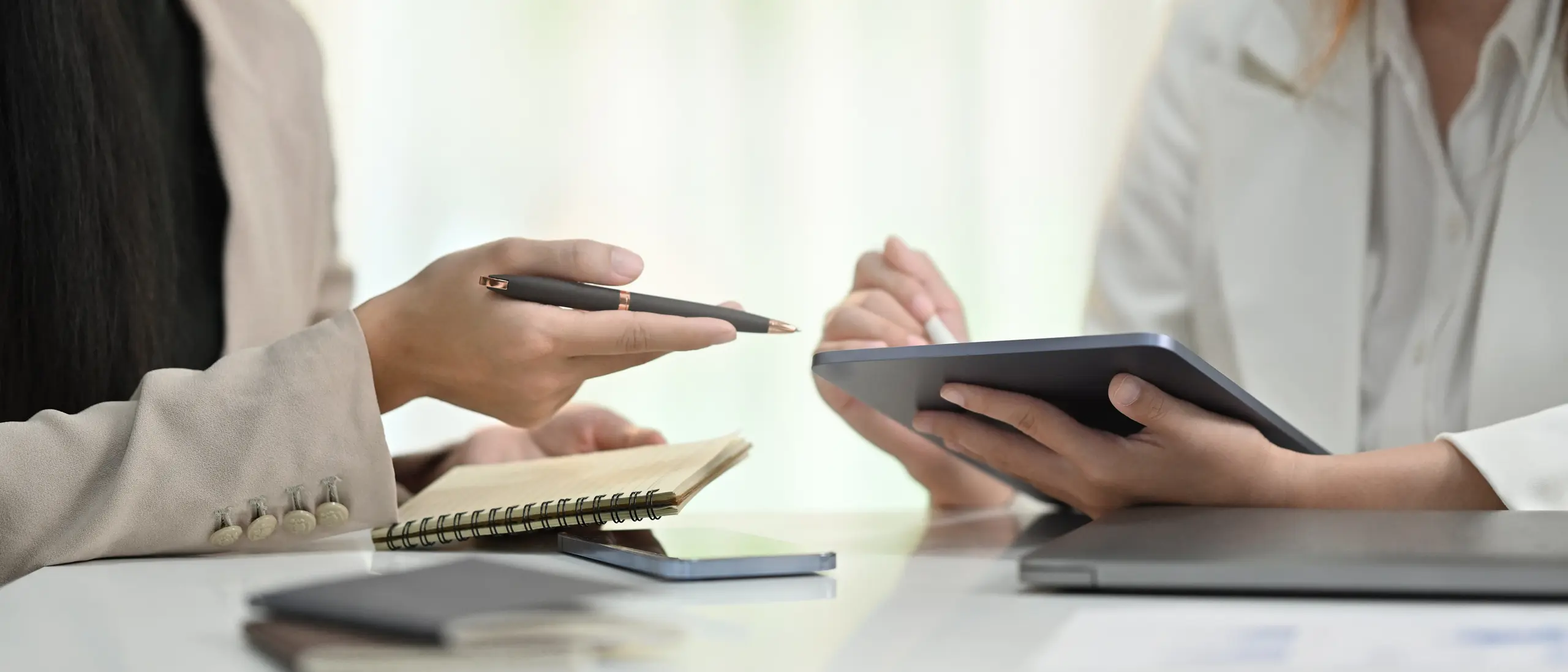 Business colleagues discussing a corporate plan together in a modern office
