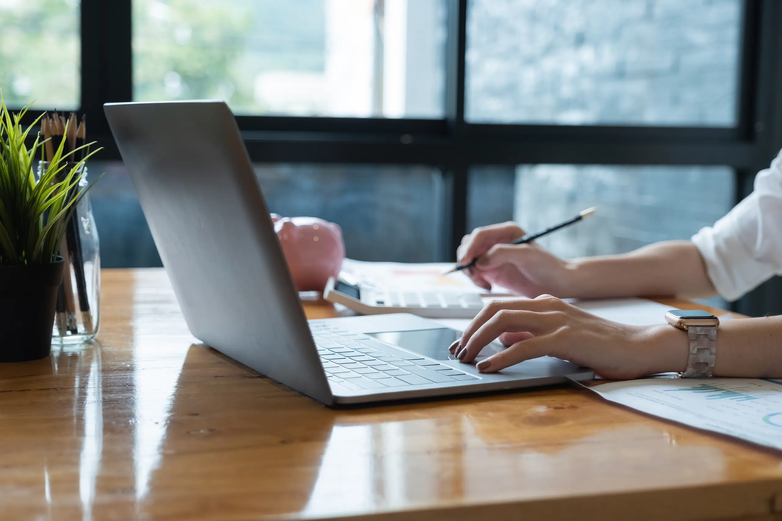 Man using a laptop at a table