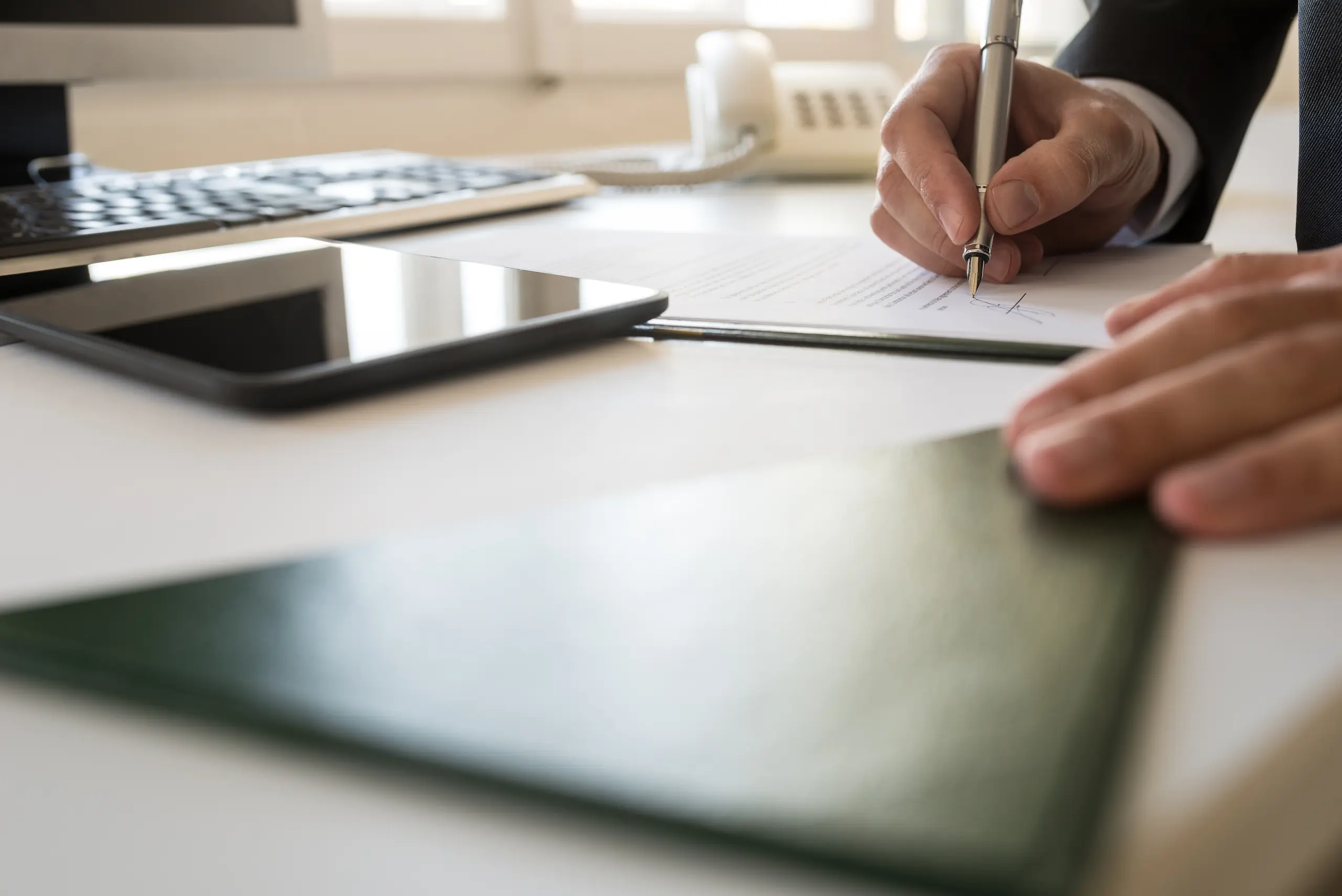 Midsection of a man working at a table