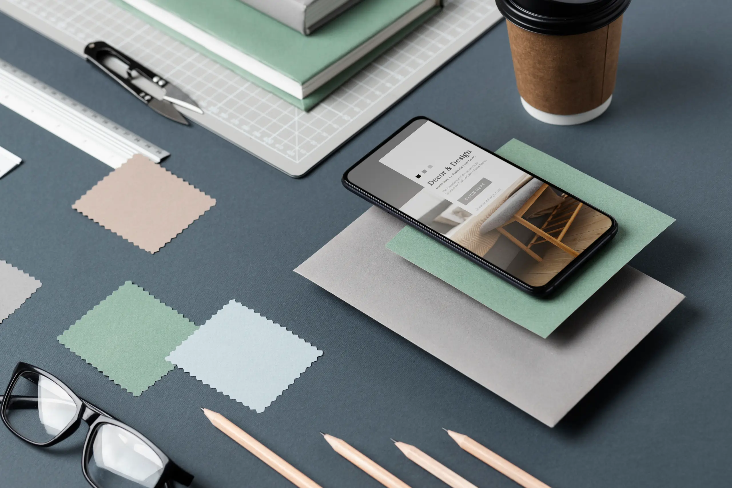 Phone mockup with glasses and coffee, top view angle