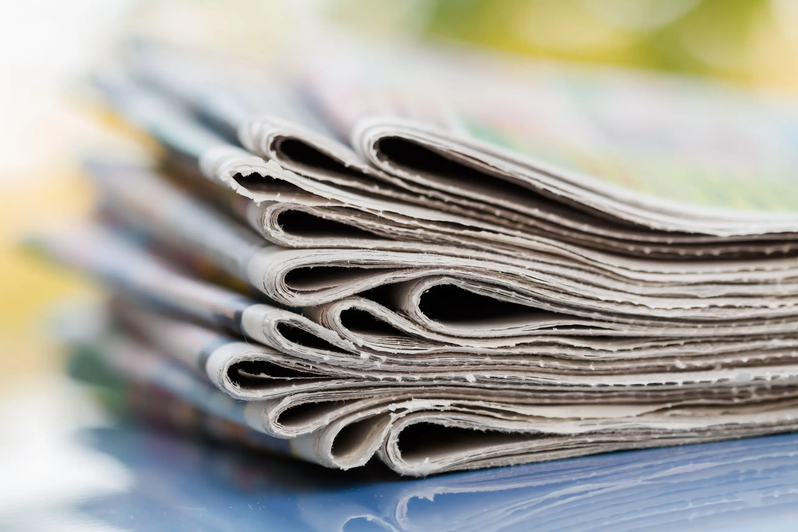 Folded and stacked newspapers